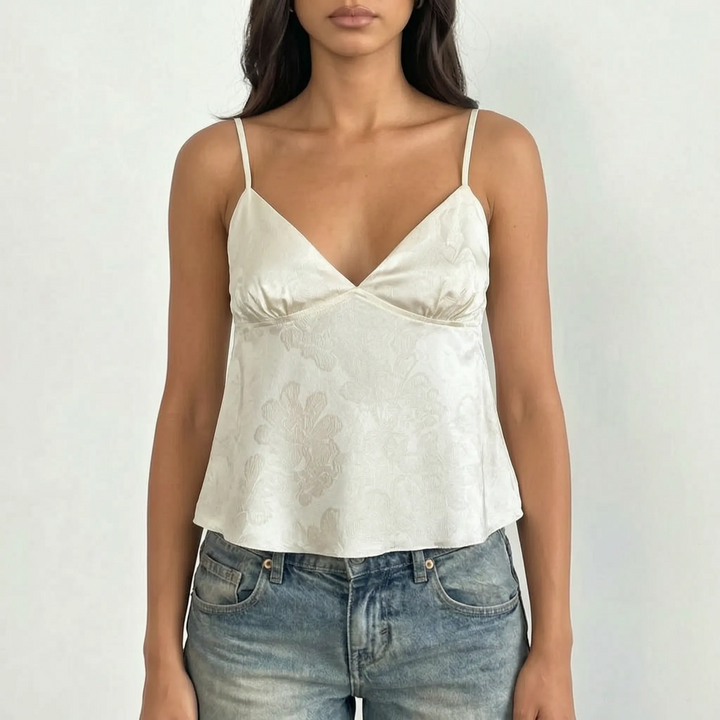Fashionable V-neck cami top for women, showcasing an exquisite floral jacquard pattern and slender straps.