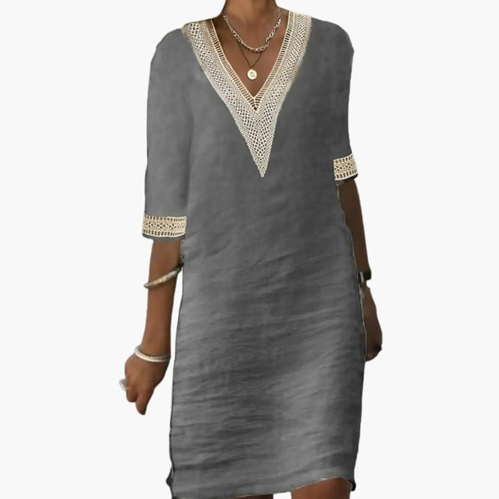 Stylish women's V-neck midi shift dress in a relaxed fit, perfect for elegant casual spring & summer fashion.
