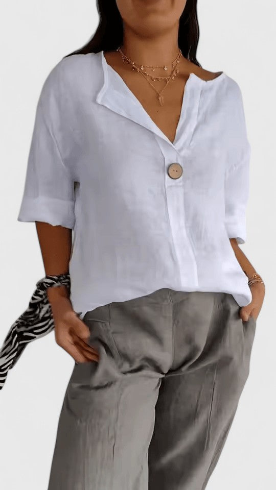 Fashionable women's summer V-neck blouse featuring a stylish knot. Loose fit top for elegant casual occasions.