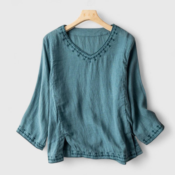 Women's elegant V-neck long sleeve blouse in white, perfect for office or casual chic style.
