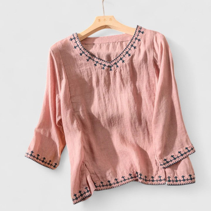 Blue women's elegant V-neck blouse with long sleeves, offering effortless style for office & casual wear.