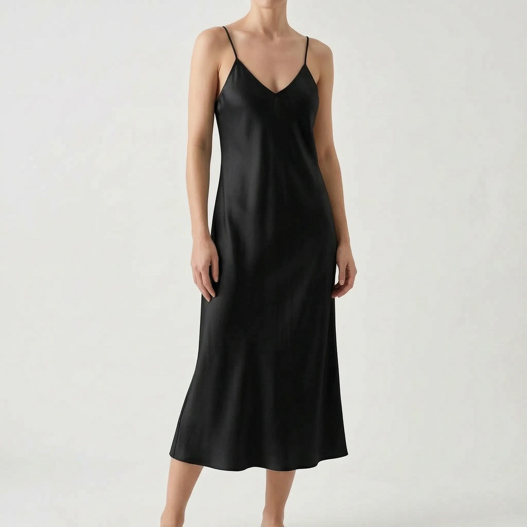 Modern women's elegant V-neck slip midi dress. A stylish summer party dress with spaghetti straps.