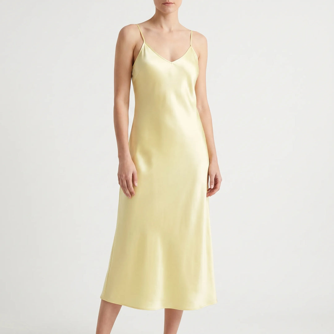 Sophisticated V-neck slip midi dress for women. Features delicate spaghetti straps and an A-line cut.