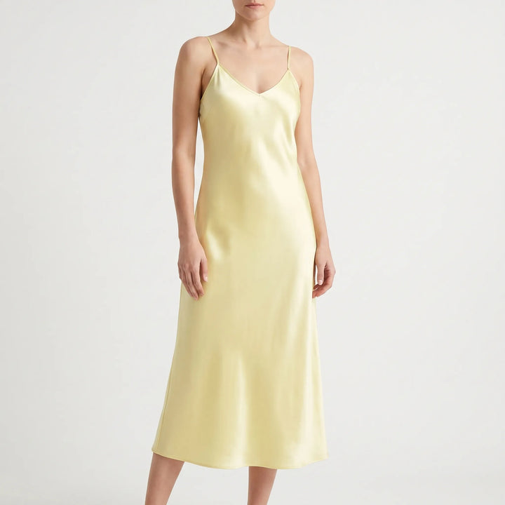 Sophisticated V-neck slip midi dress for women. Features delicate spaghetti straps and an A-line cut.