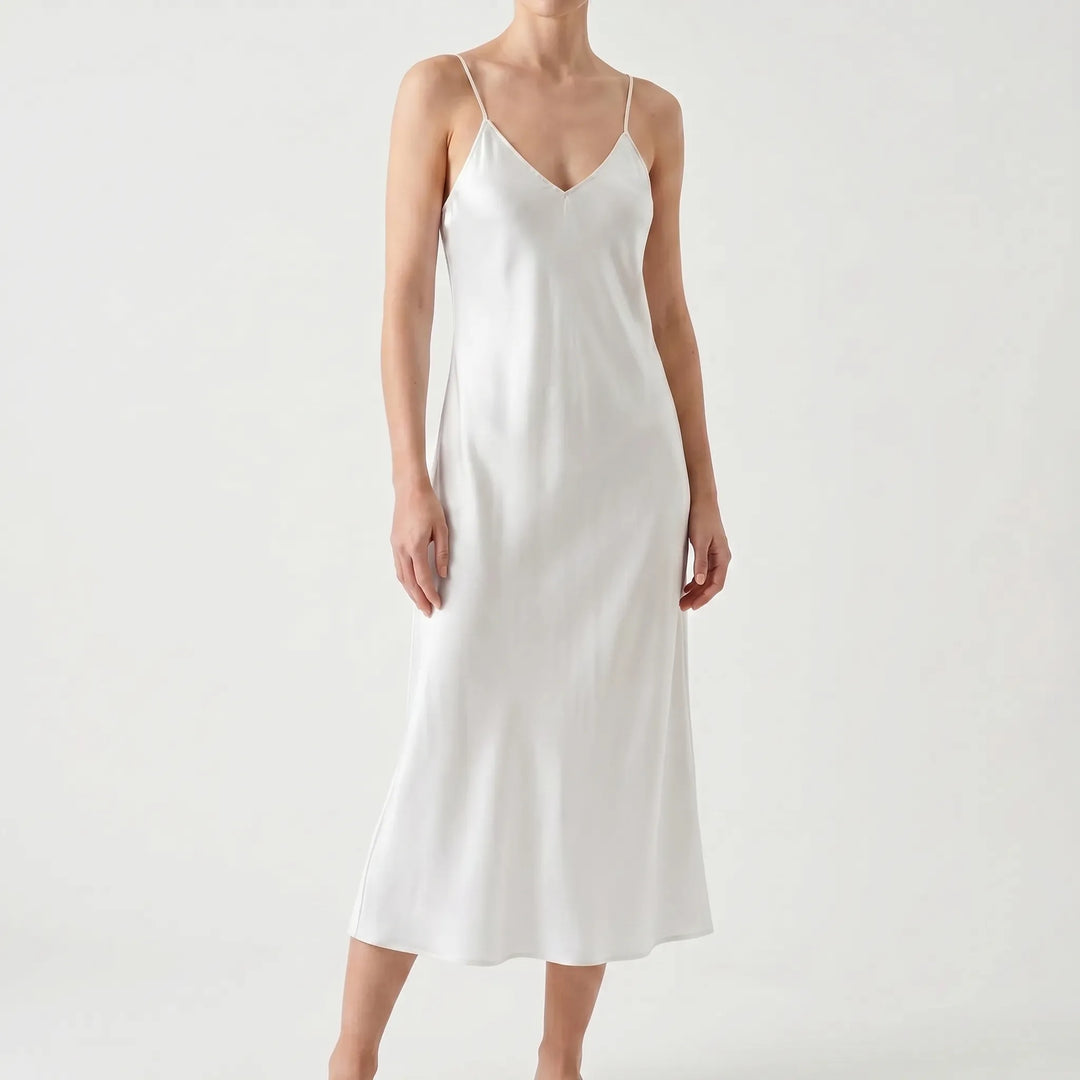 Elegant V-neck slip midi dress with spaghetti straps. A chic women's dress for summer, evening, or party.