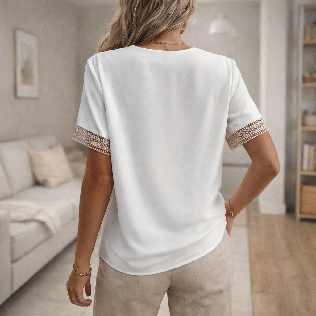 Relaxed fit short-sleeve women's top with lace trim, offering everyday comfort and versatile wear.