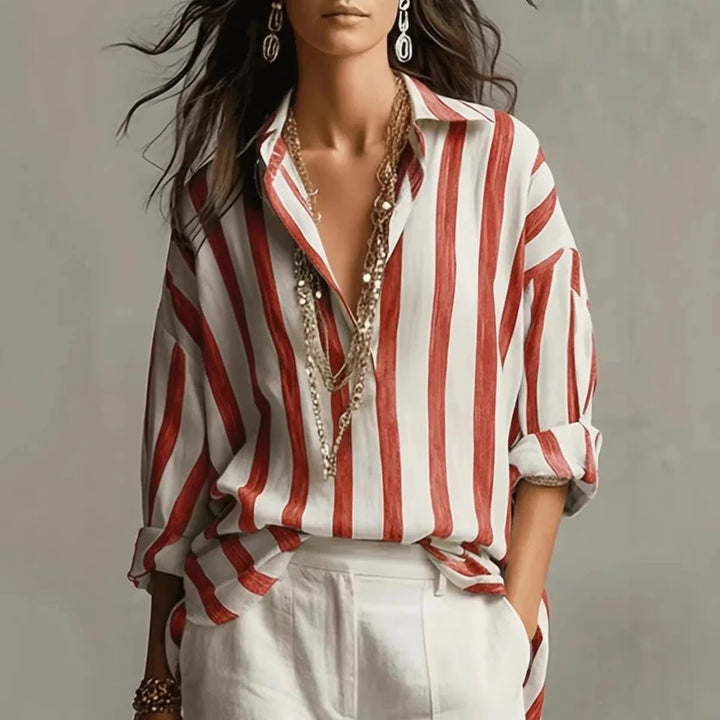 Fashionable women's vertical stripe top, featuring an elegant open collar and long sleeves. Ideal for work or leisure.