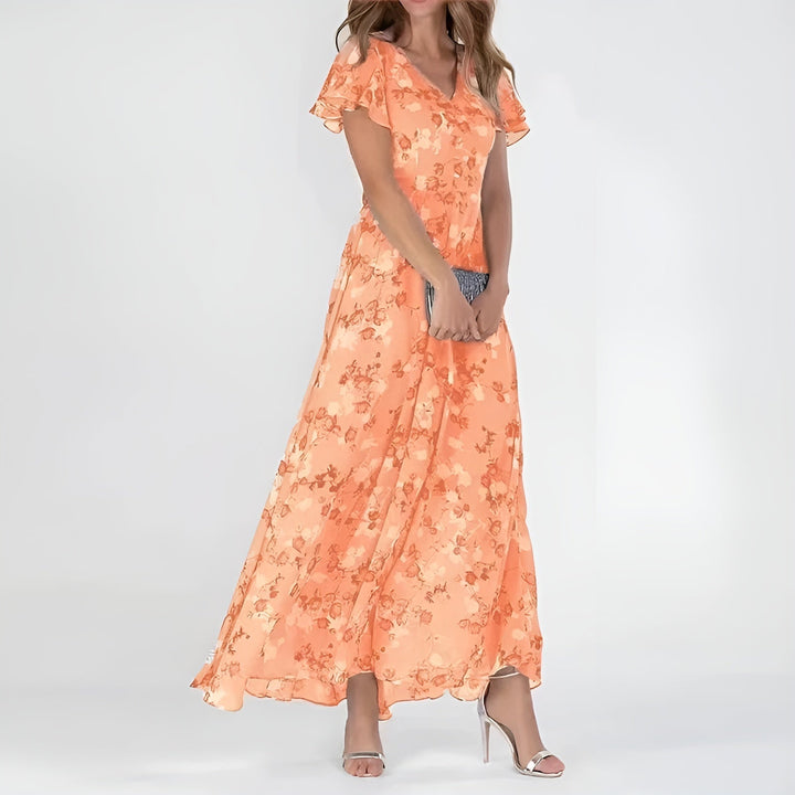 Women's elegant watercolor floral print flowing maxi dress, perfect for summer or special occasions.