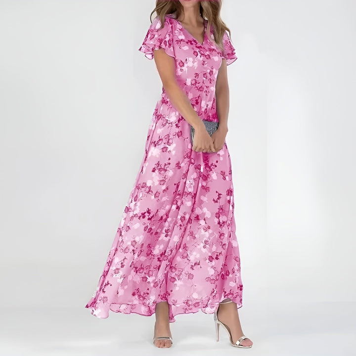 Stylish women's elegant flowing maxi dress featuring a beautiful watercolor floral design, great for casual chic.