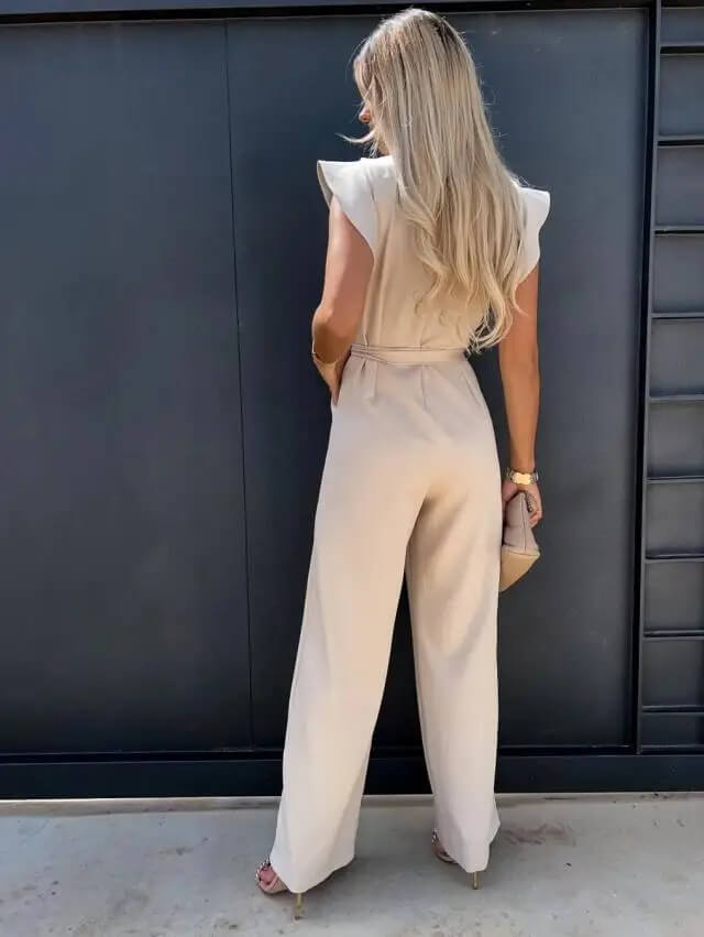 Chic women's wide leg jumpsuit, elegant belted design with butterfly sleeves for events.