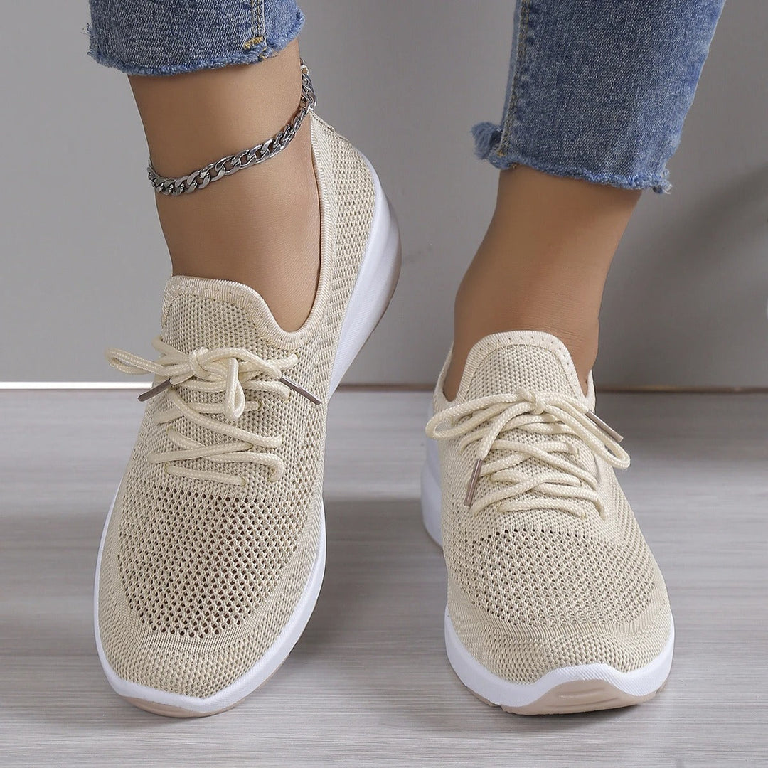 Stylish white women's platform wedge sneakers, lightweight & comfortable for walking or casual athletic wear.