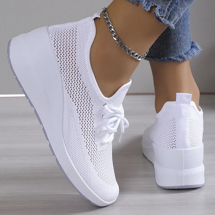 Fashion women's platform wedge sneakers, designed for comfortable walking & elevating everyday casual style.