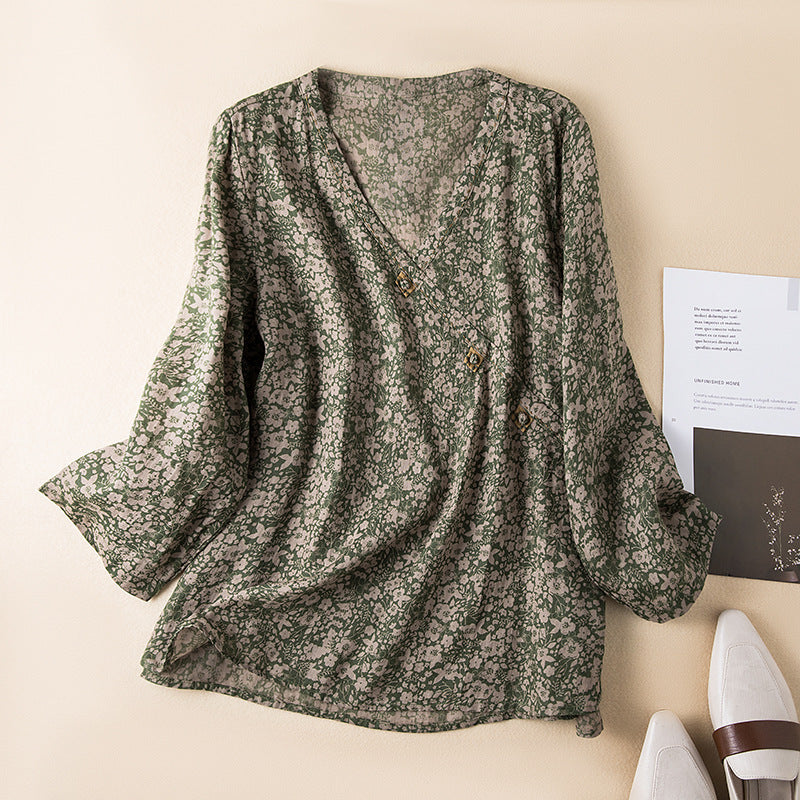 Elegant women's blouse featuring intricate embroidery, button front, and a comfortable relaxed fit.