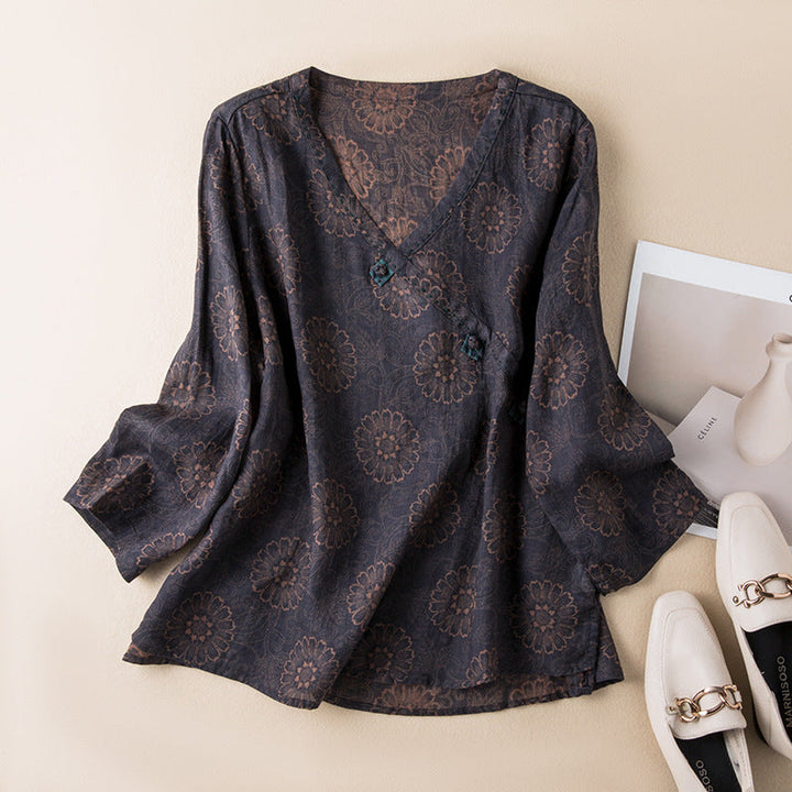 Chic women's embroidered button-front blouse, relaxed silhouette, long sleeves, great for transitional weather.