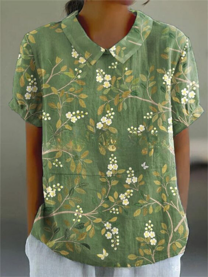 Casual yet elegant short sleeve floral embroidered blouse with Peter Pan collar for summer.