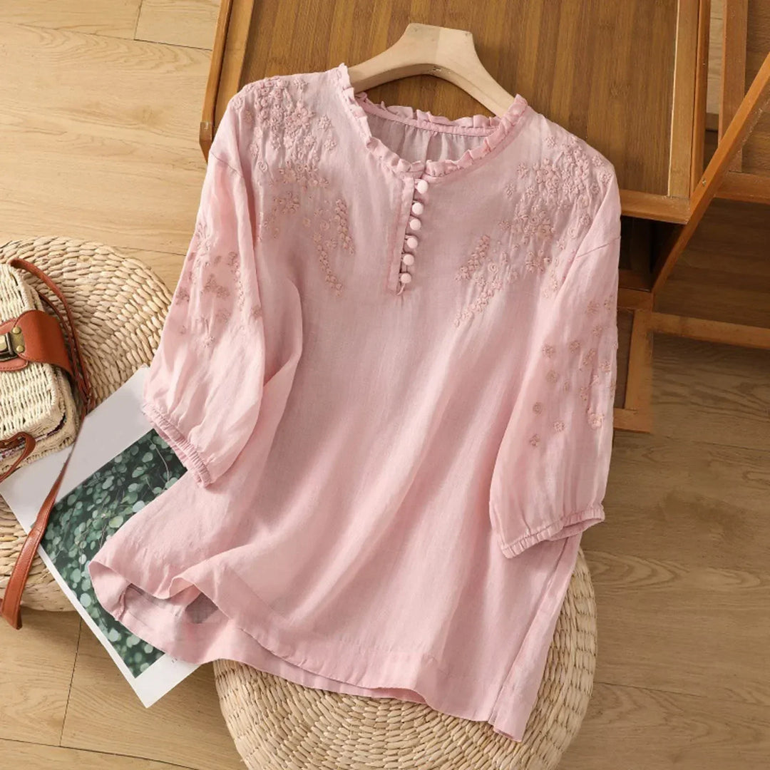 Elegant casual women's embroidered blouse, short sleeve with button neckline, offering a comfortable, flowy fit.