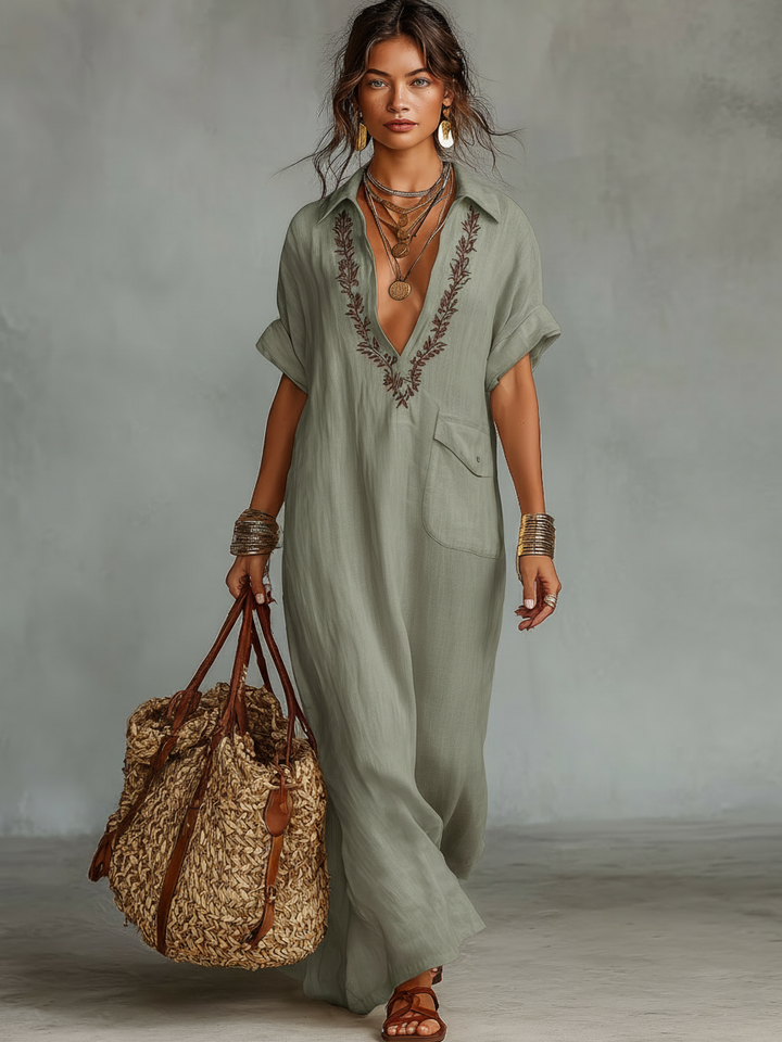 Comfortable black women's short sleeve maxi dress with intricate embroidery, great for casual summer outings.