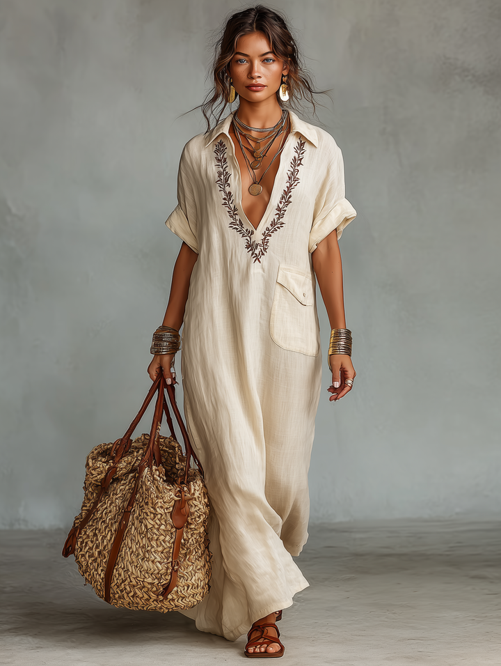 Simple yet elegant women's black embroidered maxi dress with short sleeves, perfect for everyday summer style.