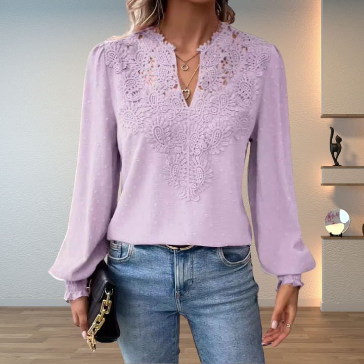Fashionable women's embroidered V-neck long sleeve blouse with puff sleeves, ideal for elegant or casual looks.