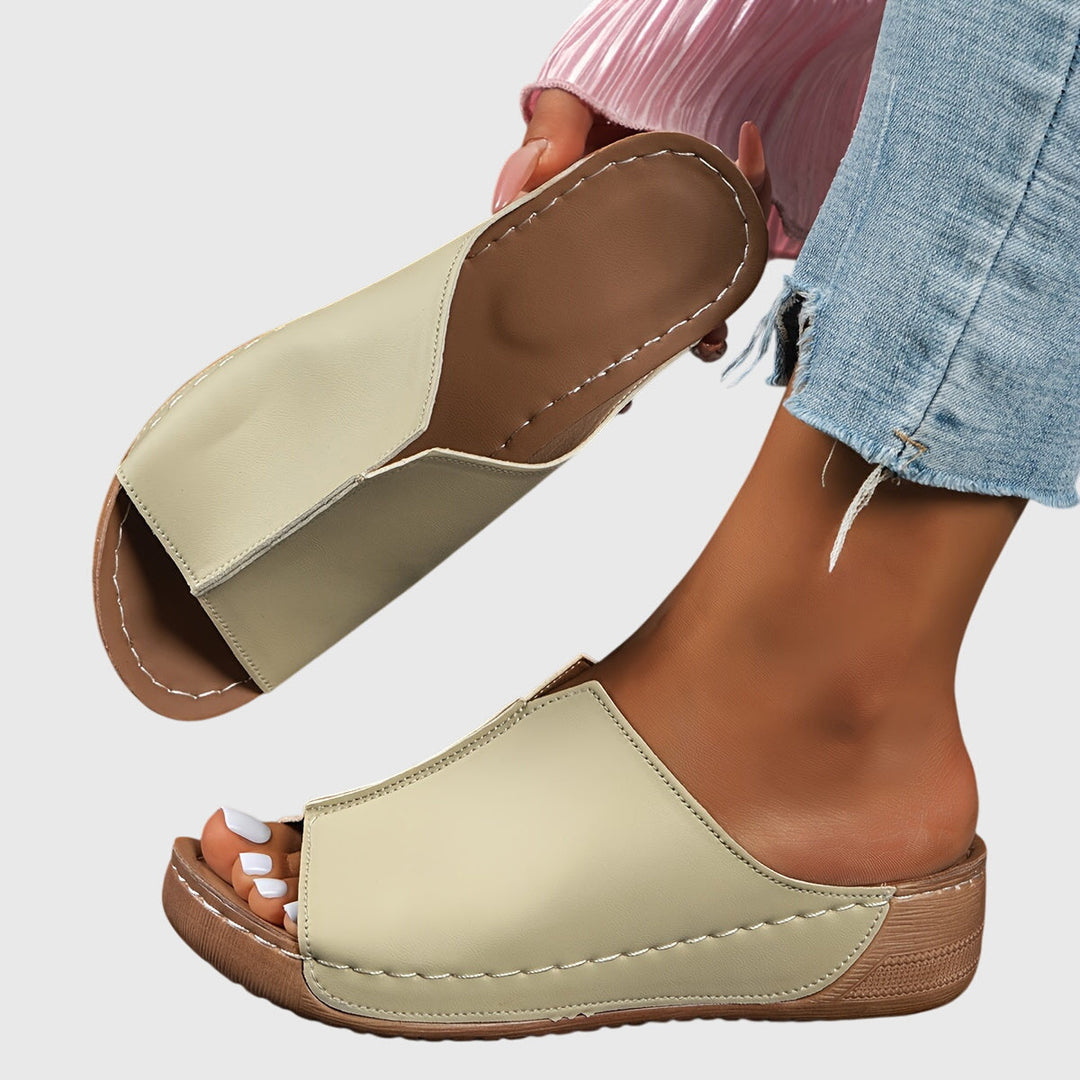 Comfortable women's flat open-toe sandals with ergonomic design, providing excellent foot support.