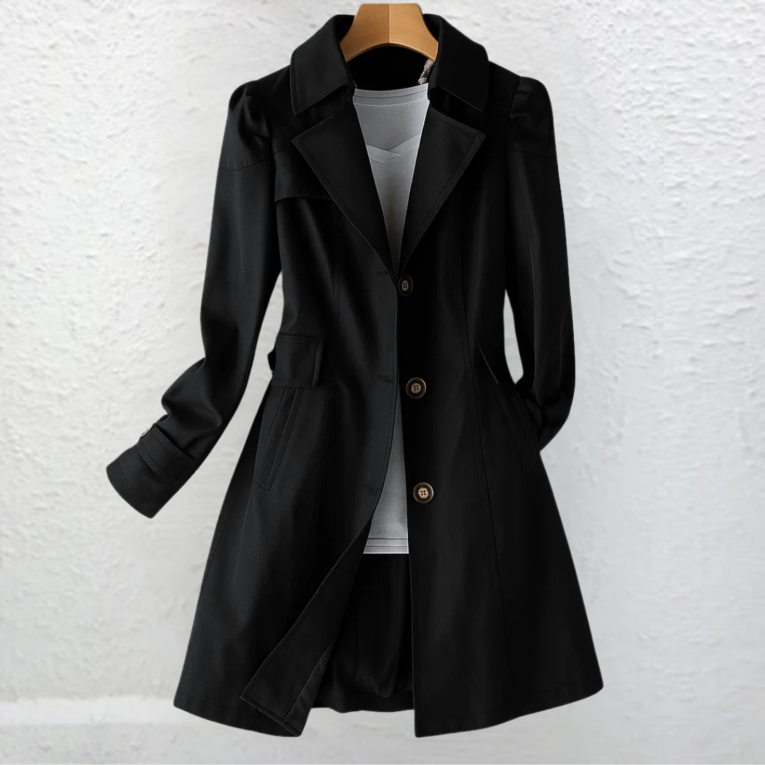 Classic women's belted trench coat, long & fitted with a structured collar, suitable for elegant workwear & spring outfits.