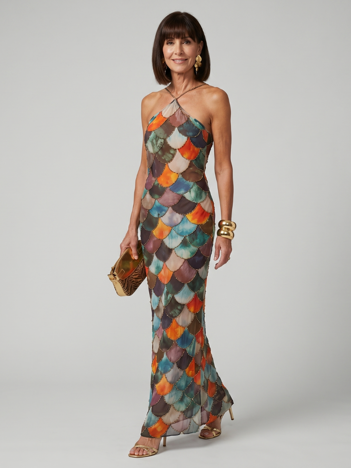Women's fitted halter maxi dress with a striking geometric print, perfect for elegant summer evenings.