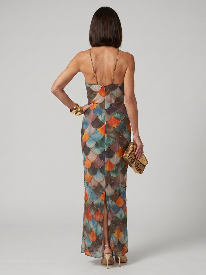Flattering women's fitted halter maxi dress with a vibrant geometric print, stylish and unique for any occasion.