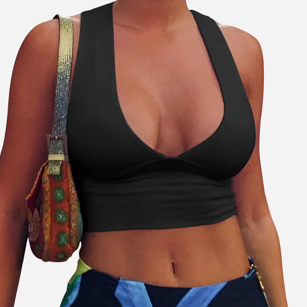 Trendy women's sleeveless crop top featuring a deep V-neck and racerback cutout for summer fashion.