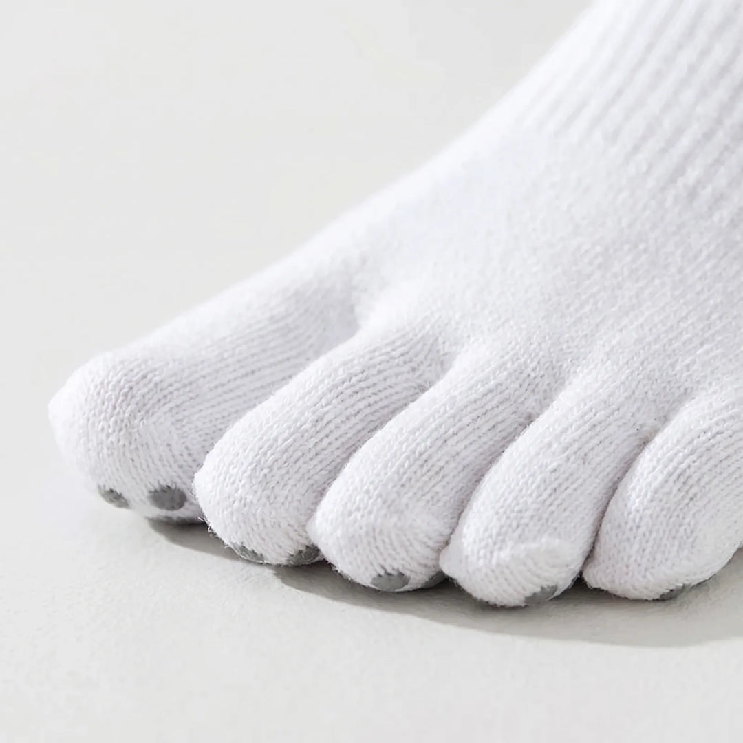 Anti-slip five-toe grip socks for women, designed for improved traction in yoga, Pilates, and barre classes.