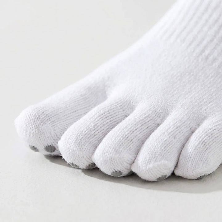 Anti-slip five-toe grip socks for women, designed for improved traction in yoga, Pilates, and barre classes.
