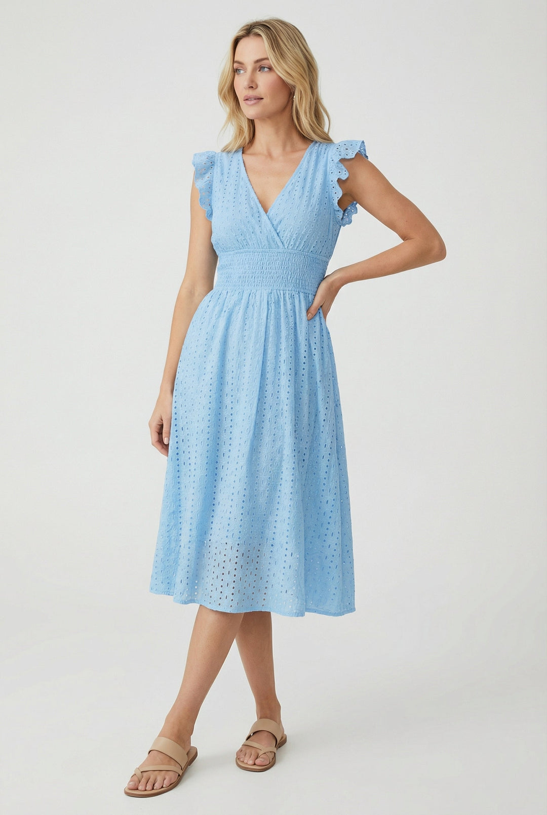 Comfortable women's flared midi dress with eyelet details, ruffled sleeves, and smocked waist.