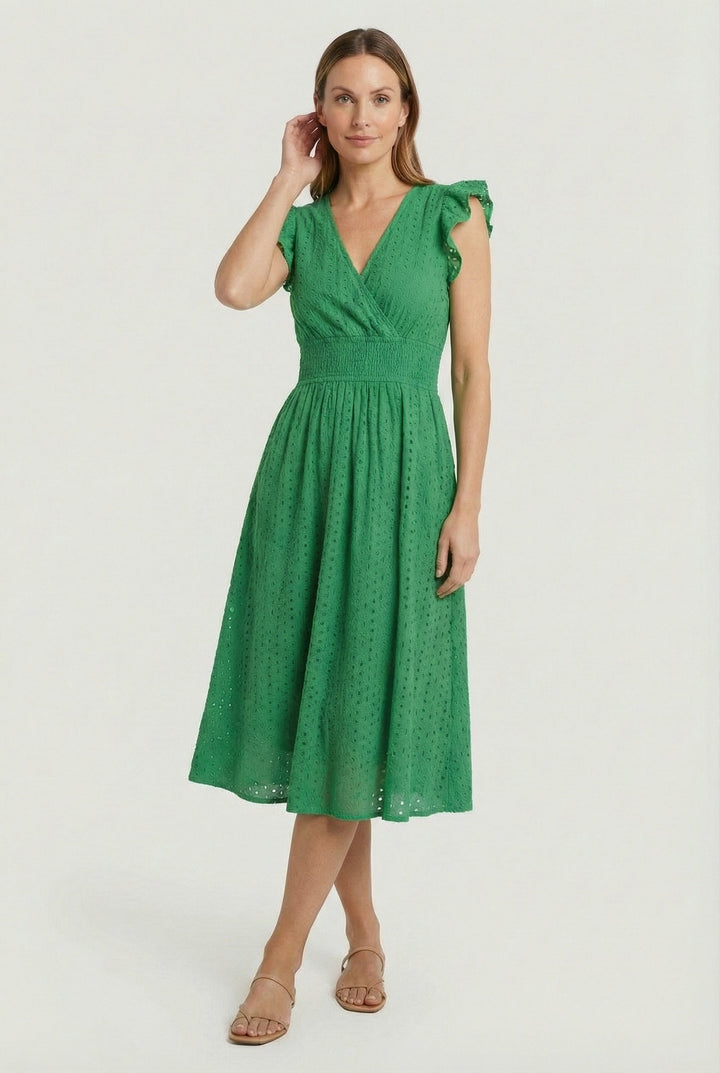 Women's eyelet midi dress with a flared skirt and cute ruffled sleeves, perfect for summer days.