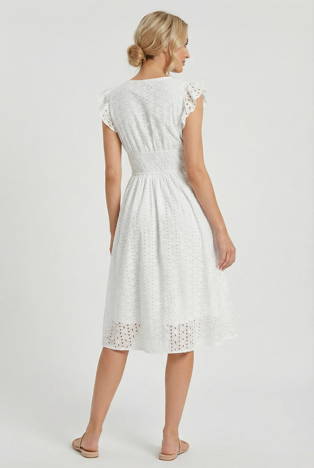 Casual summer flared midi dress with eyelet details and ruffled sleeves, ideal for beach or vacation.