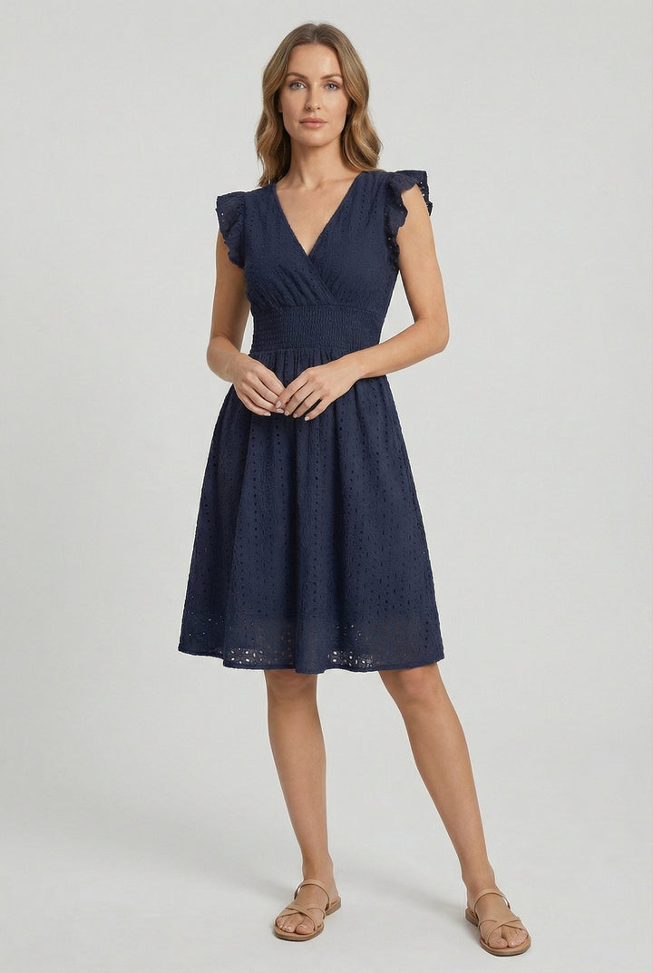Lightweight women's eyelet midi dress, flared, with ruffled sleeves. Great for casual beach wear.