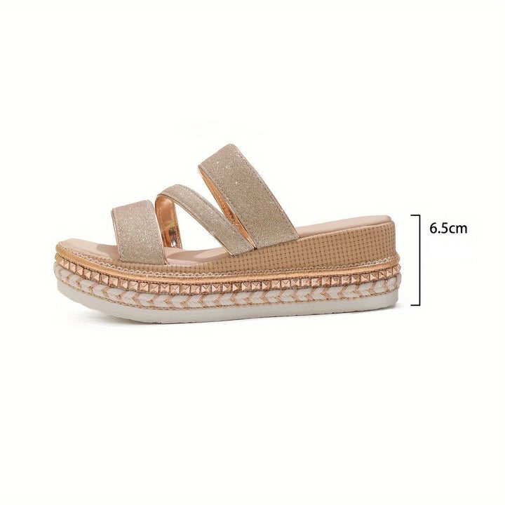 Woman wearing comfortable flat casual sandals, perfect for summer walks & relaxed everyday style.