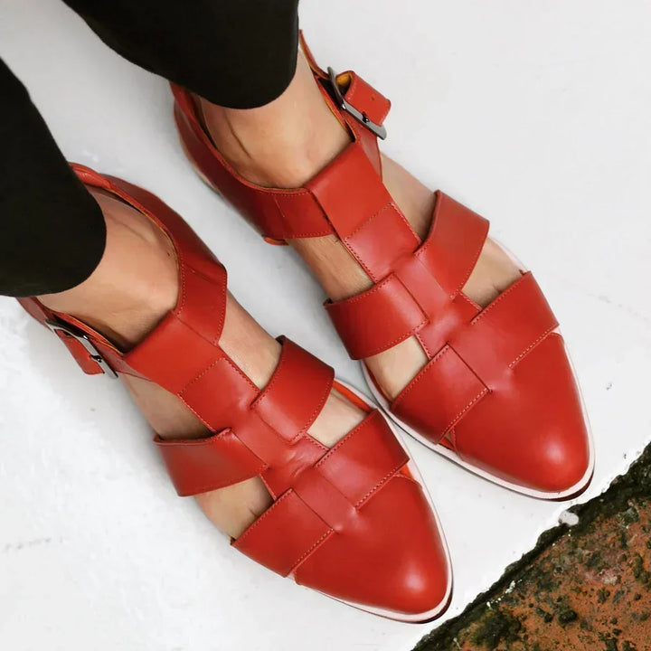 Women's flat sandals with intricate woven straps and adjustable buckle. Perfect for casual summer comfort and everyday wear.