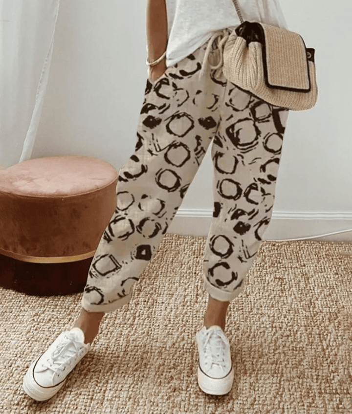 Comfortable women's printed pants with a flattering fit & drawstring waist, ideal for versatile casual or loungewear.