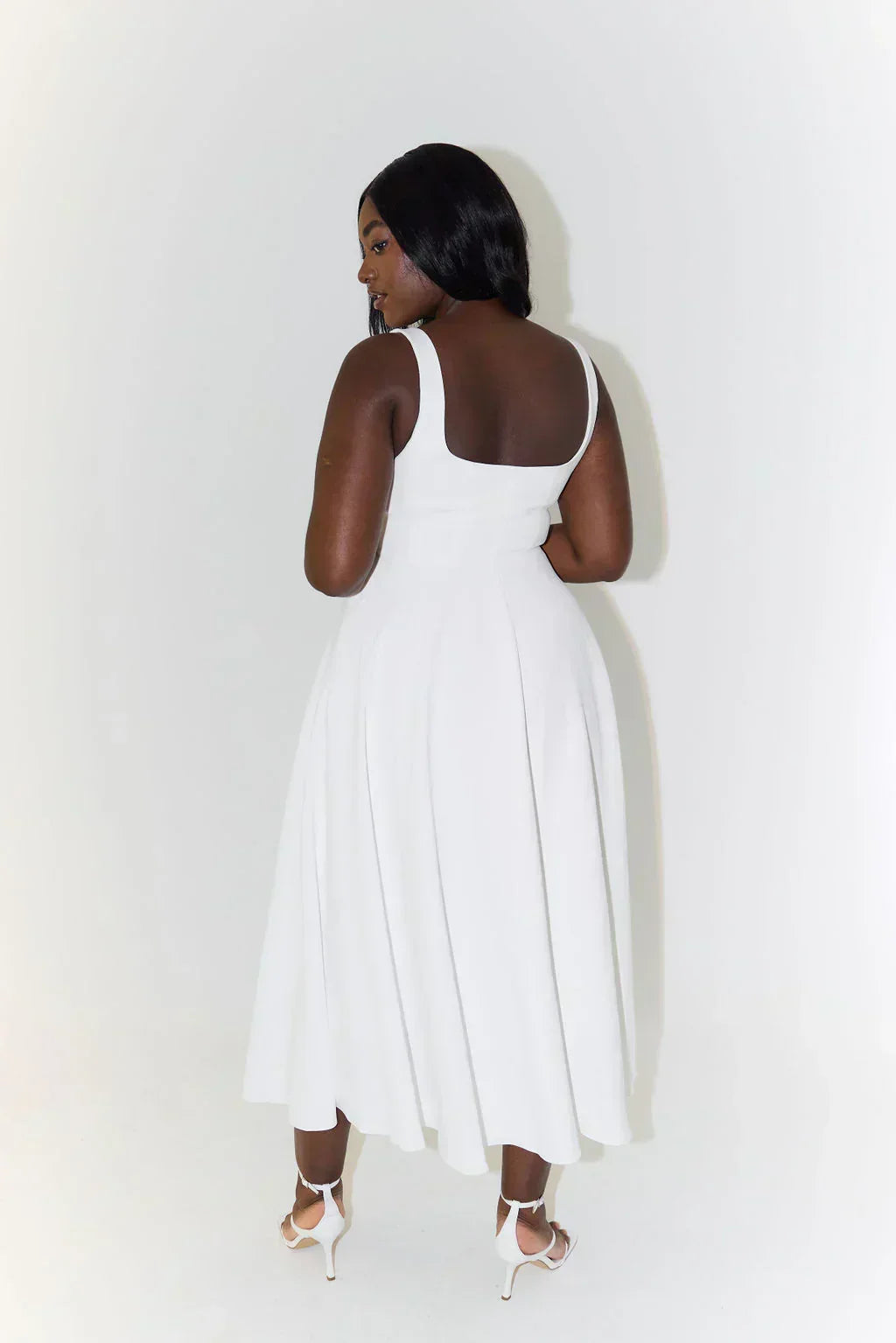 Timeless women's midi dress with a square neckline, offering a flattering and elegant silhouette.