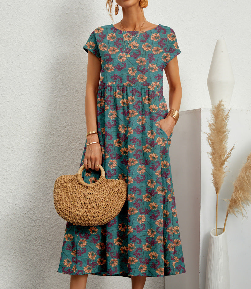Vibrant red floral A-line short sleeve dress for women. Comfortable knee-length print, ideal for casual summer style.
