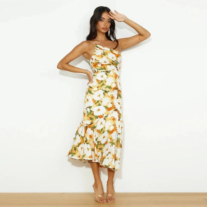 Women's party floral midi dress, sleeveless and elegant, featuring an asymmetric flowing hemline.