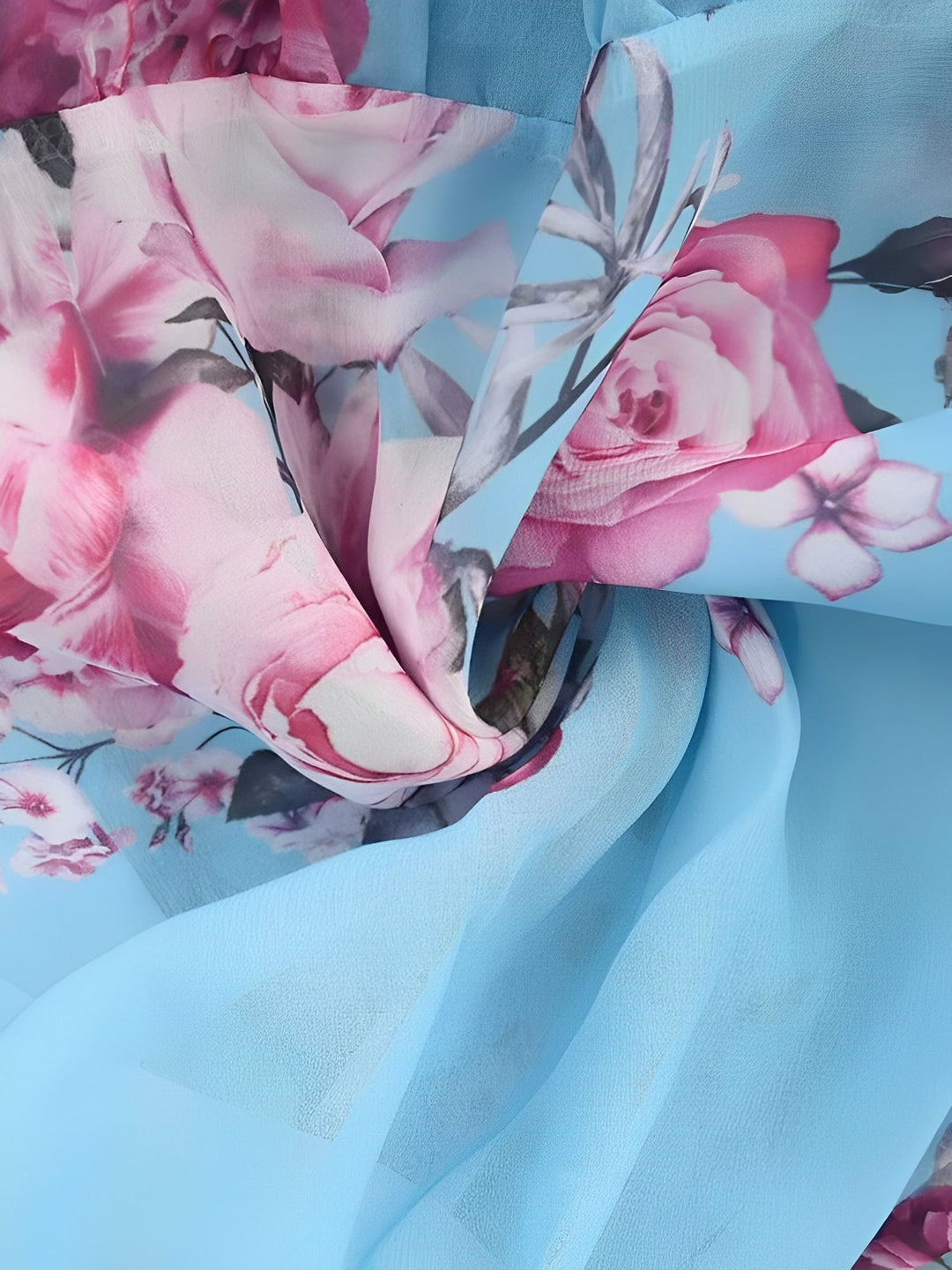 Woman wearing a casual floral cold shoulder mini dress with ruffles, enjoying a relaxed spring day.