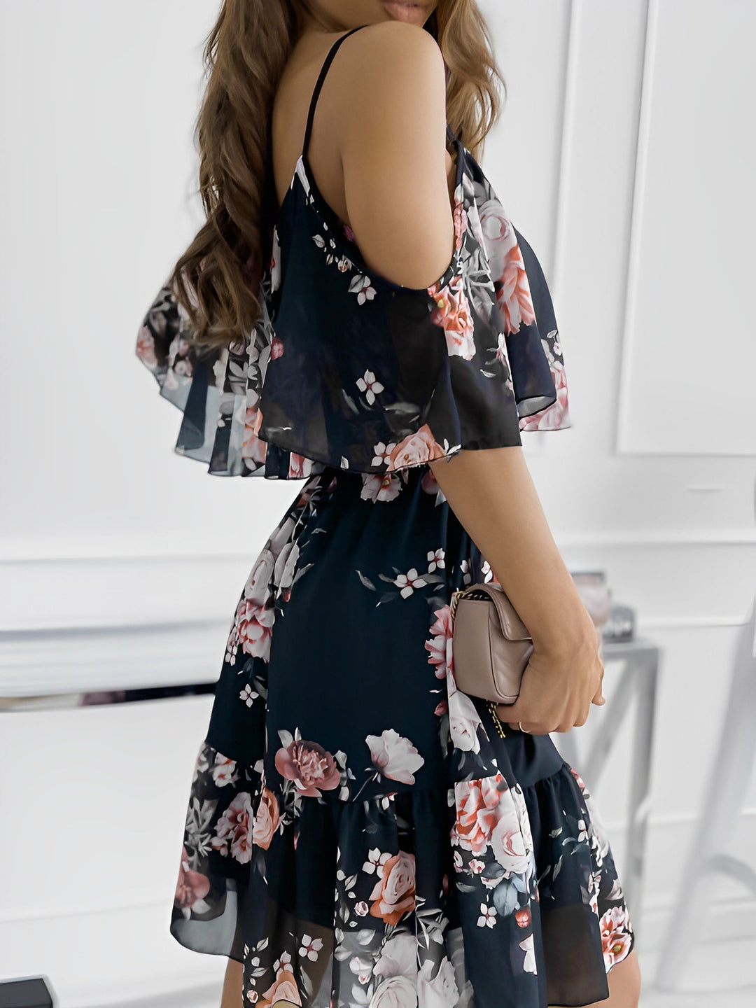 Trendy women's floral mini dress featuring cold shoulder, ruffle trim, and a flattering flowy fit for summer.