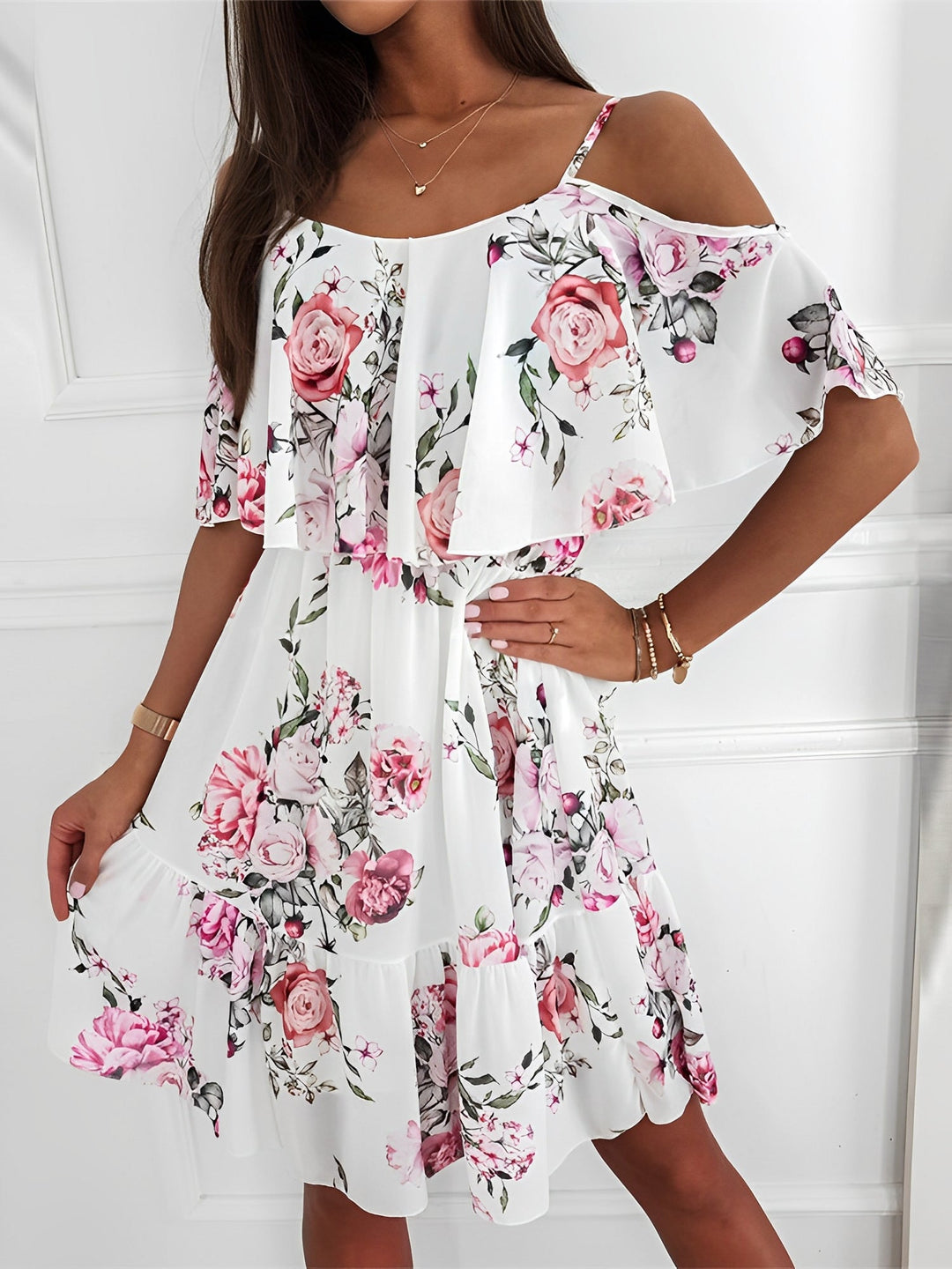 Vibrant floral pattern on a women's cold shoulder mini dress. Ideal for spring fashion & casual wear.