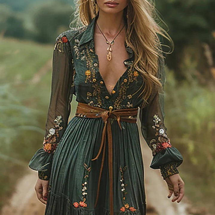 Flowy long-sleeve boho maxi dress for women, featuring intricate floral embroidery & summer fashion.