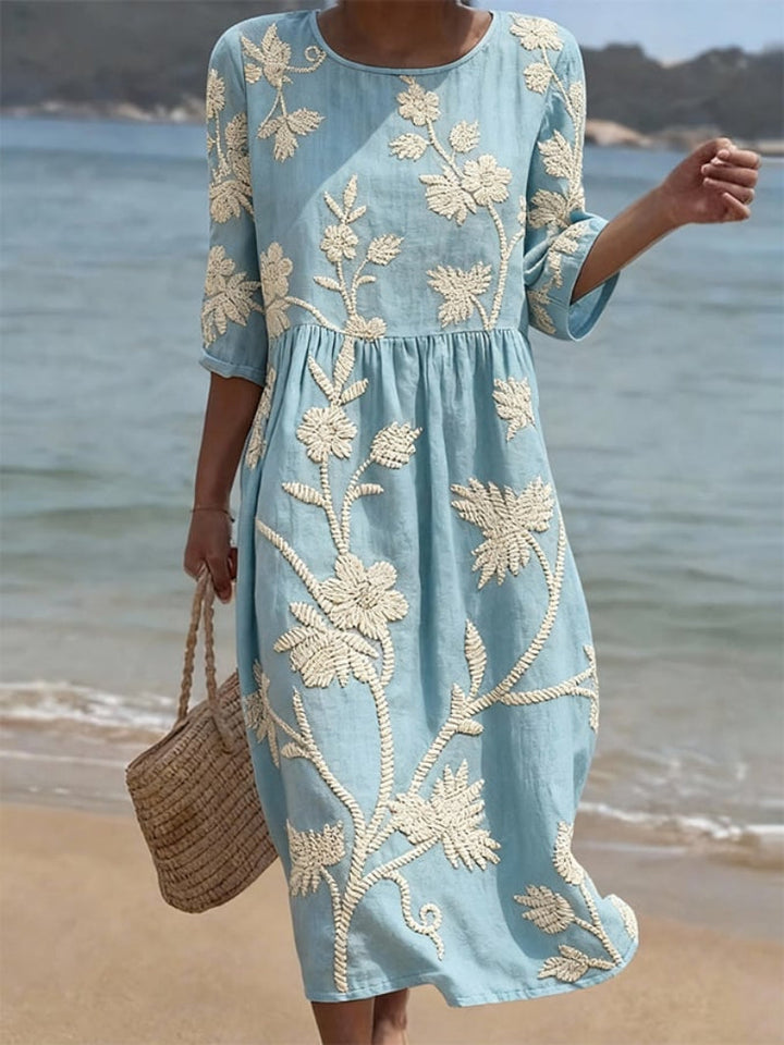 Women's floral embroidered midi dress with 3/4 sleeves, perfect for casual summer outings & day wear.