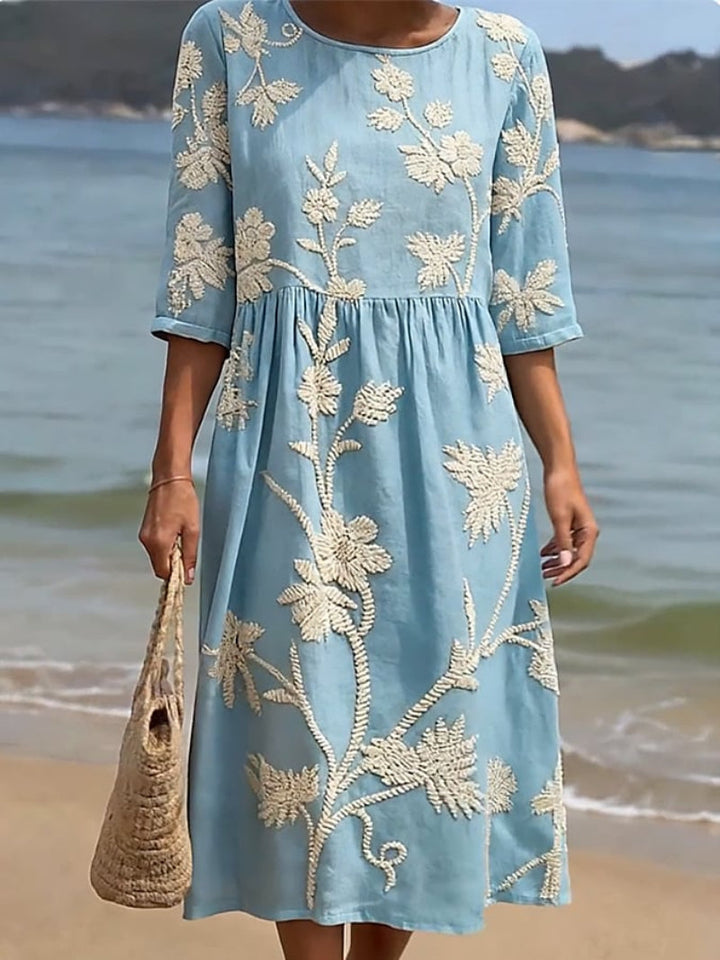 Comfortable relaxed fit midi dress for women, adorned with beautiful floral embroidery & practical three-quarter sleeves.