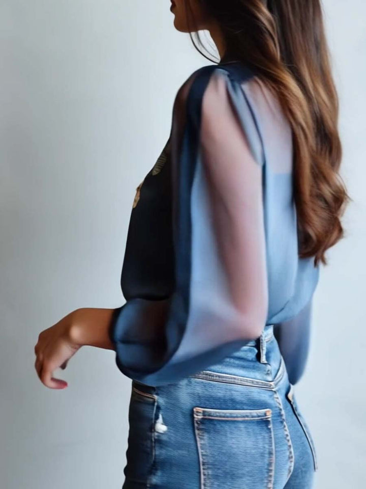 Chic women's blouse with delicate floral embroidery & sheer long sleeves. Perfect day-to-night top.