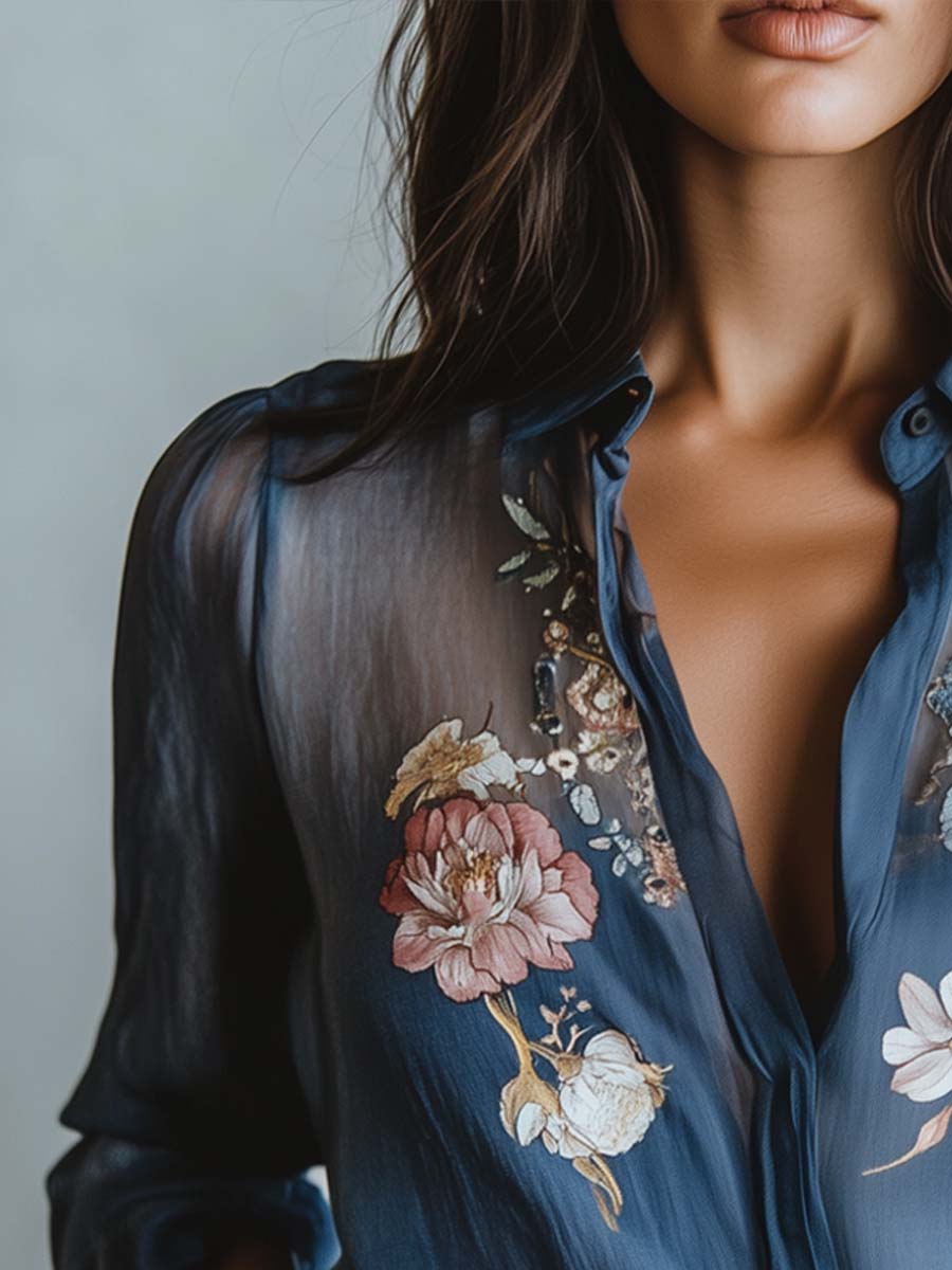 Women's sheer sleeve blouse with beautiful floral embroidery. Versatile, comfortable V-neck top.