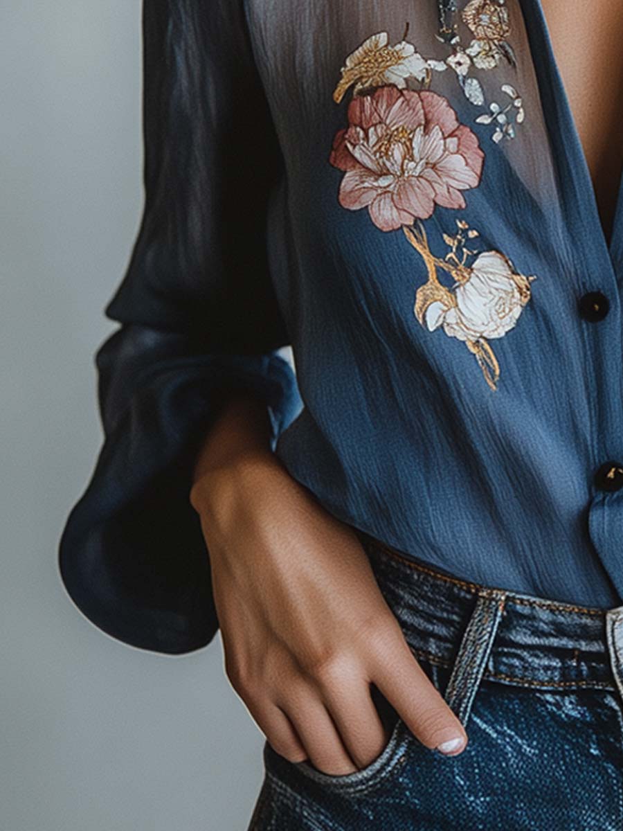 Stylish women's blouse: floral embroidery, sheer sleeves, V-neck, relaxed fit. Chic apparel.