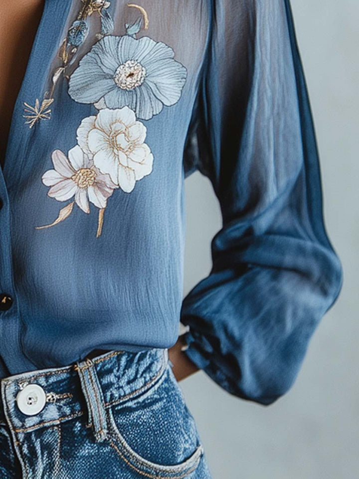 Chic women's top with sheer long sleeves and delicate floral embroidery. Elegant for any occasion.